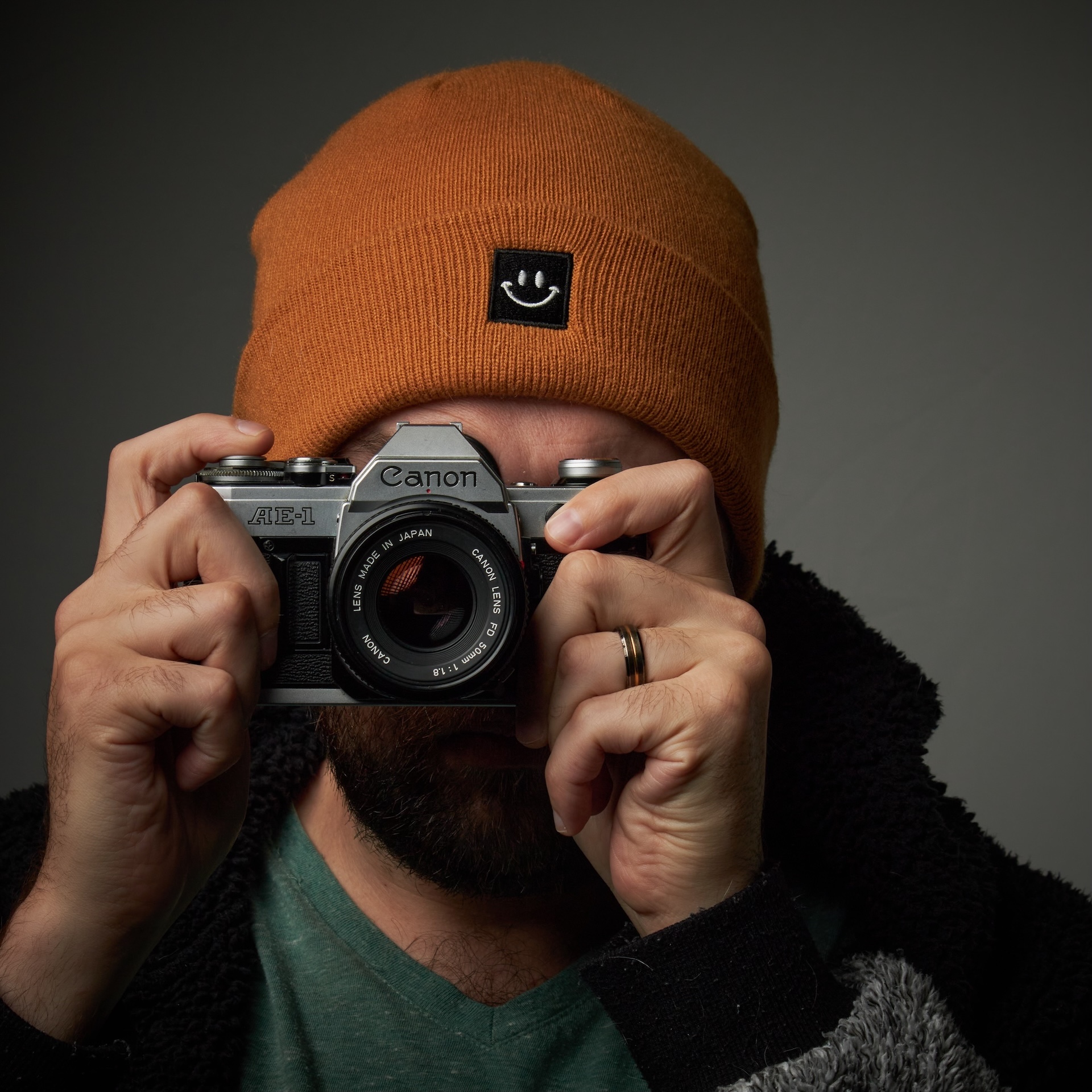Aimeri Baddouh holding a Canon AE-1 film camera