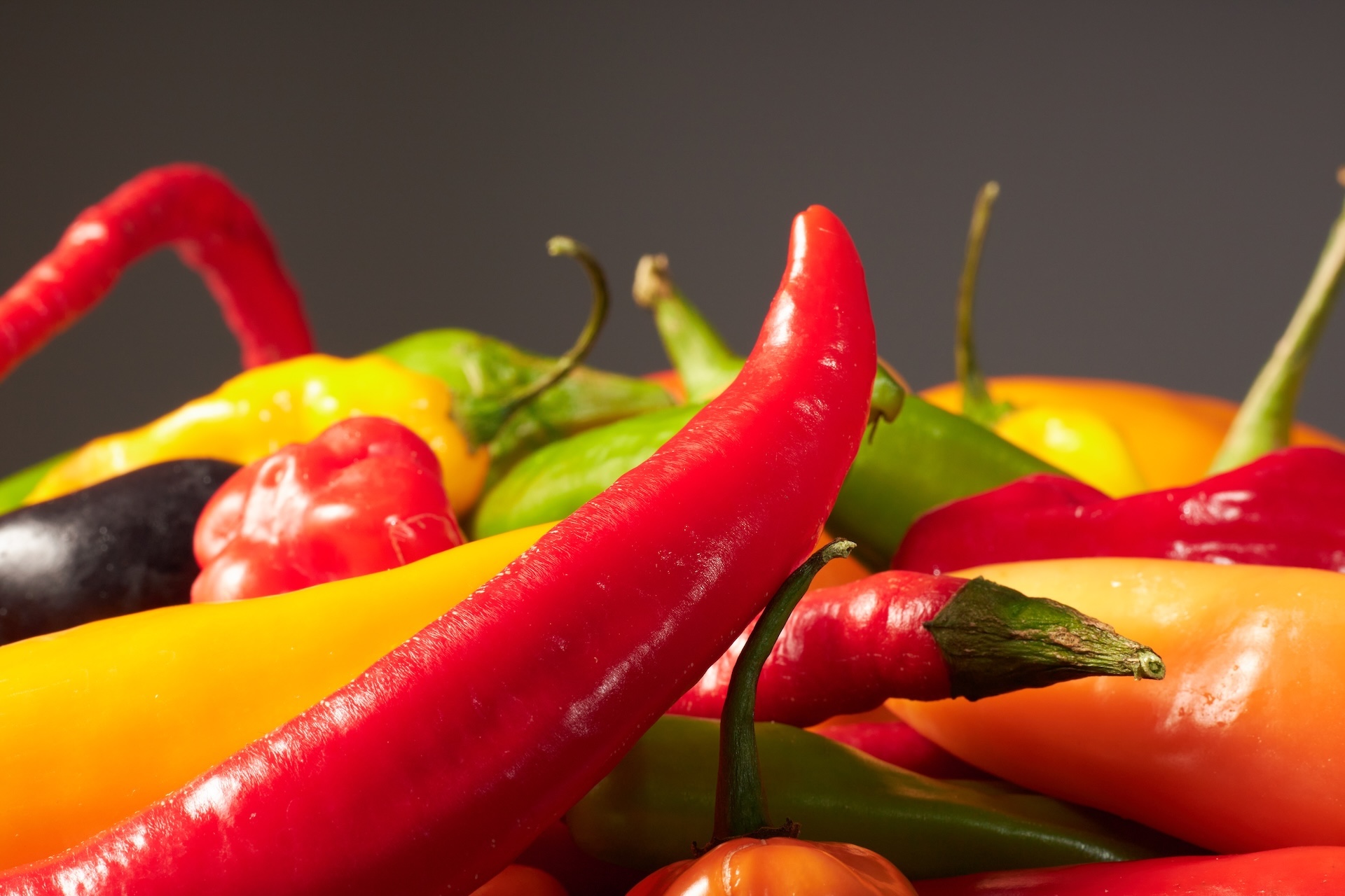 Fresh peppers close-up, vibrant on dark
