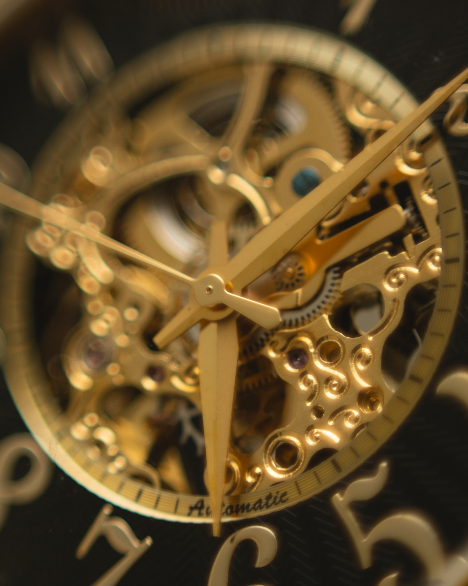 Watch movement macro — gold gears and hands