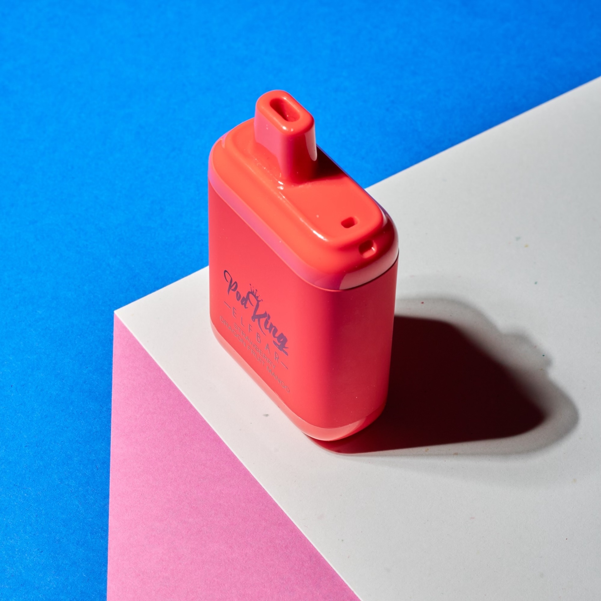 Coral device on blue and pink geometric background